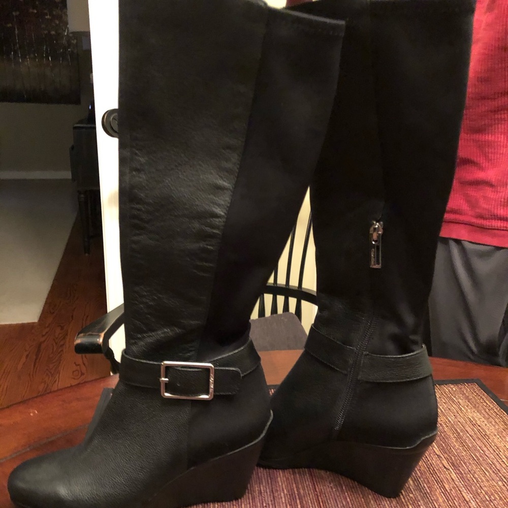 Calvin Klein knee high black boots.  NWT
